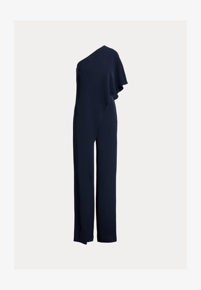 Jumpsuit navy à une épaule avec un volant drapé sur un côté, coupe ajustée avec jambes larges, confectionné en tissu lisse et léger.