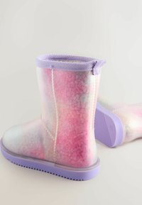 Pastel-colored rain boots made of translucent material, featuring a lilac trim, textured sole, and a speckled pink and white gradient pattern.