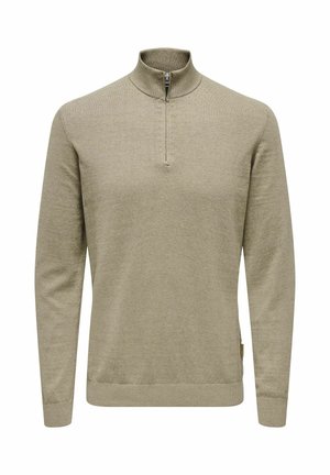 Suéter verde olivo claro con cuello tipo cima con cremallera, mangas largas y puños y dobladillo acanalados. Hecho de una suave tela texturizada.