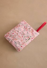 Pink quilted pouch with floral and cartoon characters pattern, red hanging loop, and Cath Kidston x Moomin label on beige background.
