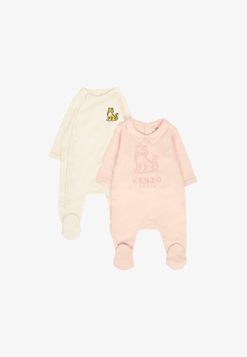 Due body neonato: uno crema con stampa di tigre gialla e chiusura a scatto, l'altro rosa chiaro con design di tigre in rilievo e colletto.