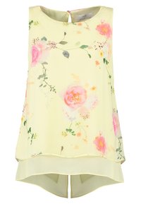 Tílko bez rukávů z lehké žluté látky s květinovým vzorem v růžové a zelené barvě. Má střih s delší zadní částí a zapínání na knoflíky vzadu.