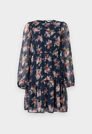 Marineblauwe jurk met lange mouwen, roze en witte bloemenprint, elastieke taille, doorschijnende pofmouwen en een geplooide rok.