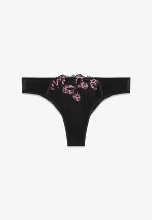 Perizoma in pizzo nero con ricamo floreale rosa e nero sul davanti e pannelli laterali trasparenti.