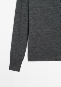 Dark gray knit sweater with long sleeves, featuring a button closure along the front and ribbed cuff and hem for texture.