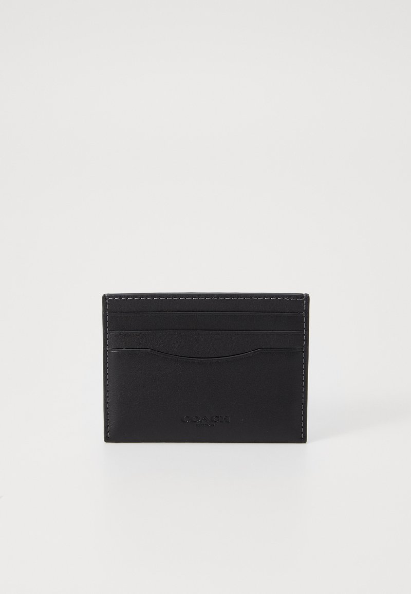 Black leather card holder with four card slots, subtle stitched edges, and a debossed logo. Smooth texture, rectangular design.