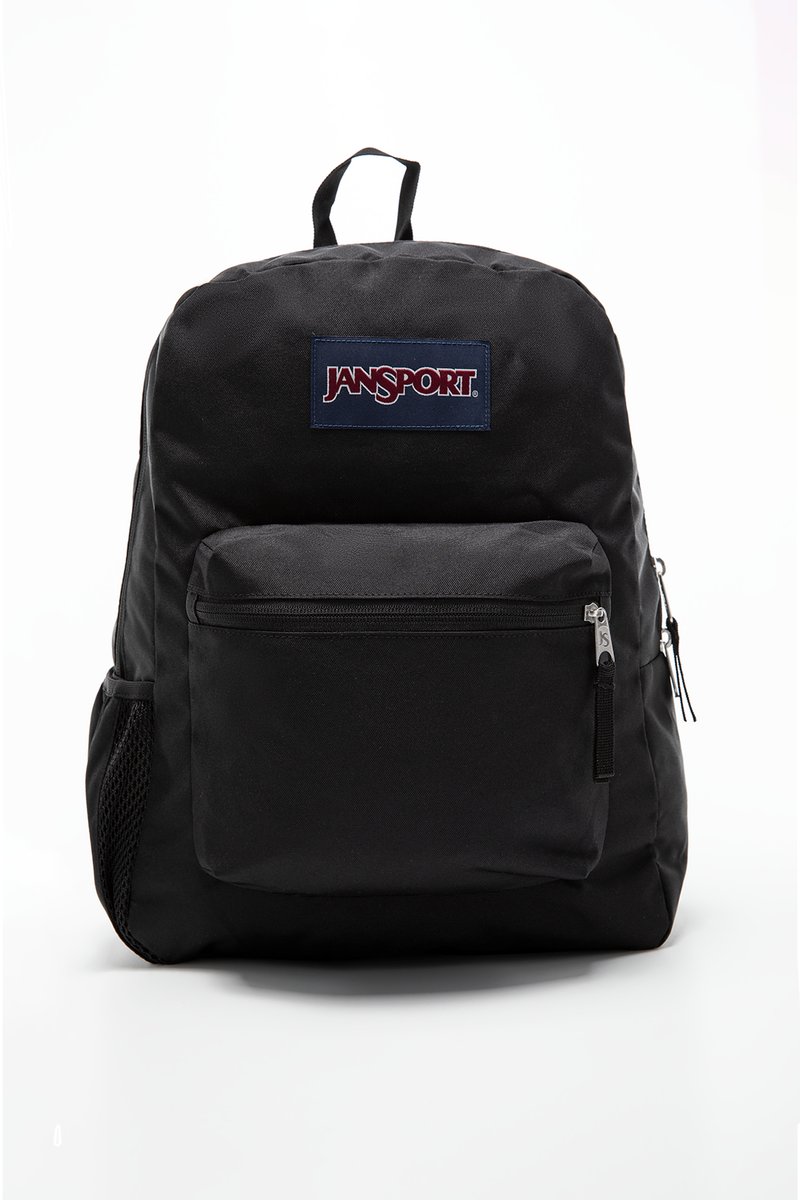 Sac à dos Jansport noir avec une poche zippée à l'avant, une poche latérale en mesh et une poignée en tissu. Le matériau est un polyester durable et lisse.