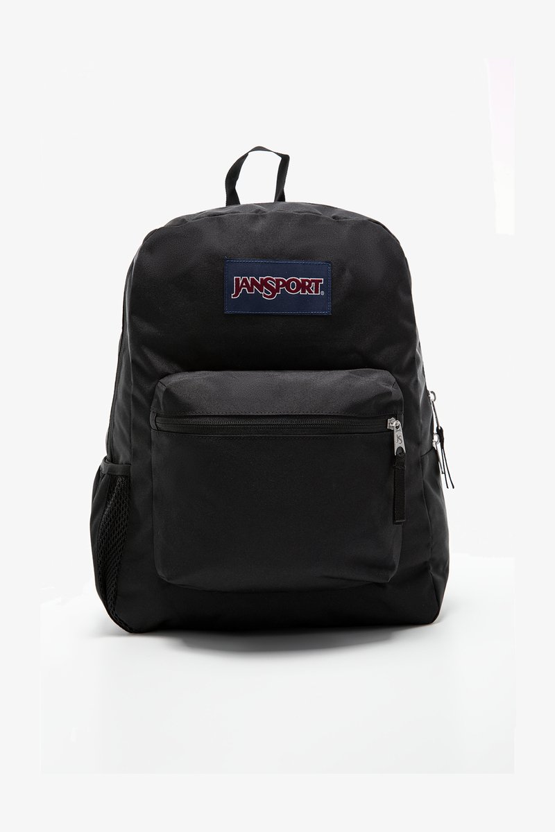 Sac à dos Jansport noir avec une poche zippée à l'avant, une poche latérale en mesh et une poignée en tissu. Le matériau est un polyester durable et lisse.