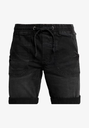 Shorts in denim nero con vita elasticizzata, chiusura con cordino, orli arrotolati e due tasche laterali. Presentano una finitura morbida e testurizzata.