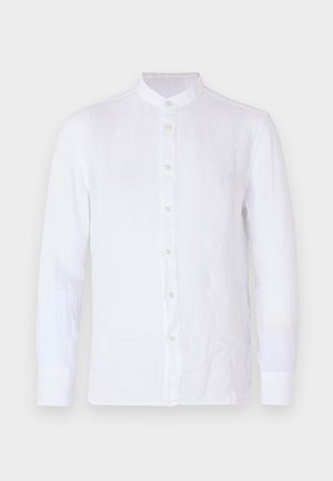 Valge pikkade varrukatega särk, mis on valmistatud kerge linast, võimaldab mandariini krae, eesmine nööbiga kinni tõmbamine ja pehme, tekstuuriga viimistlus.