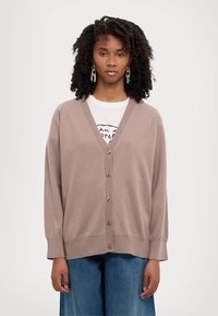 Light brown cardigan made of soft fabric, featuring a V-neck, button-down front, and ribbed cuffs with a relaxed fit.