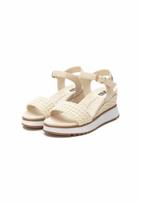 Sandali platform beige con cinturini in tessuto intrecciato, fibbia regolabile alla caviglia e suola in gomma bianca con fondo testurizzato per una buona aderenza.