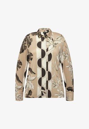 Lange mouw blouse van beige stof met bloemen- en cirkelpatronen in zwart en crème. Met kraag en knoopsluiting.