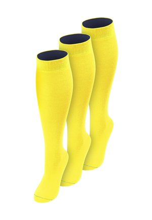 Drei leuchtend gelbe knielange Socken mit dunklem Innenfutter, aufrecht stehend und leicht nach rechts geneigt dargestellt.