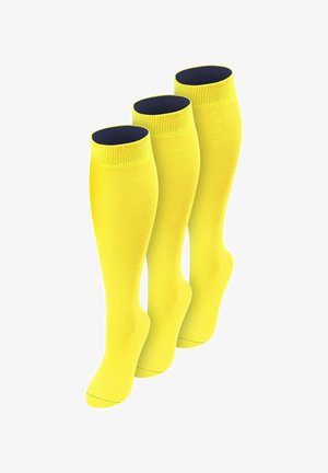 Drei leuchtend gelbe knielange Socken mit dunklem Innenfutter, aufrecht stehend und leicht nach rechts geneigt dargestellt.