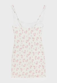 White sleeveless dress with pink rose floral pattern and adjustable thin shoulder straps on a plain background.