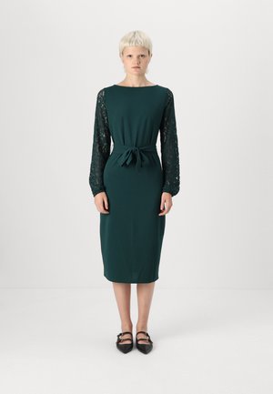 Dark green dress with long lace sleeves, round neckline, and a belted waist. Knee-length and form-fitting, with minimal detailing.