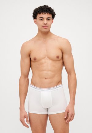 Boxeri din bumbac alb, cu un design ajustat, având o talie elastică cu brand. Textură moale și stil minimalist.