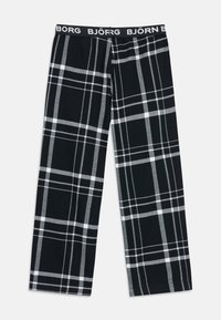 Calças de pijama em padrão xadrez preto e branco com pernas largas e uma cintura preta que exibe o logótipo branco da Björn Borg repetido à sua volta.