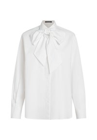 White button-up shirt with long sleeves, featuring a large bow at the collar, made from smooth fabric with a crisp texture.