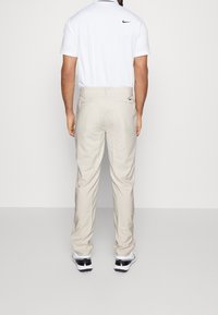 Nike Golf Tygbyxor - off-white