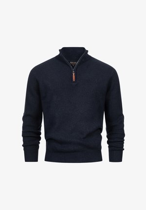 Mørk marineblå ribbestrikket genser med kvart-zip krage og lange ermer, liggende flatt på en hvit bakgrunn.