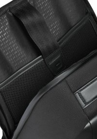 Black backpack with textured fabric, mesh pockets, and smooth leather accents. Features sturdy straps and interior compartments for organization.
