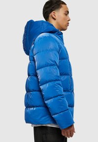 Blue puffer jacket with a shiny finish, featuring a hood, quilted design, and front zip pocket. The fabric appears smooth and slightly padded.