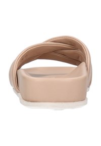 Light beige slide sandal with textured, crossed straps and a flat, rectangular sole. Smooth faux leather material, cushioned footbed.