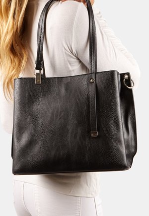 Black faux leather tote bag with two sturdy handles, rectangular shape, textured finish, and metal hardware accents. Smooth interior.