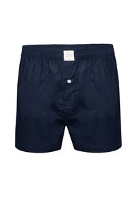 Navy blue men's cotton boxer shorts with elastic waistband and single white button fly, label centered on waistband.