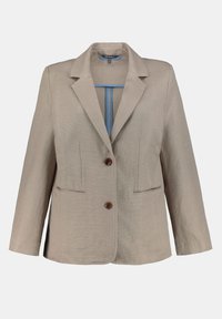 Blazer beige avec une finition texturée, fermeture à un bouton marron, deux poches avant, et une bande bleue contrastante à l'intérieur. Col cranté standard.