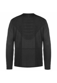 Zwarte lange mouwen shirt met een textuur van gaasdesign. Heeft een ronde hals en subtiele detailachtige achterkant. Lichtgewicht stof voor ademend vermogen.