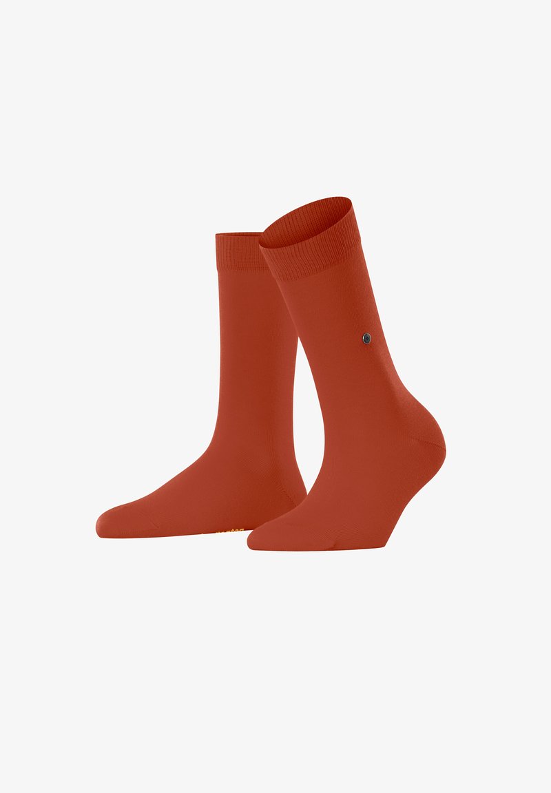 Deux paires de chaussettes orange vif sont exposées ensemble, présentant une texture de tissu lisse et un design simple.