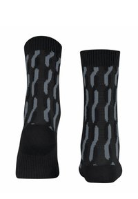 Schwarze Socken mit einem strukturierten Muster aus wellenförmigen grauen Linien. Strickkonstruktion mit einem gerippten Abschluss für einen sicheren Sitz.