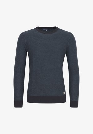 Dark blue sweater made of soft fabric, featuring a round neckline, long sleeves, and dark ribbed trim at cuffs and hem. Small logo tag on side.