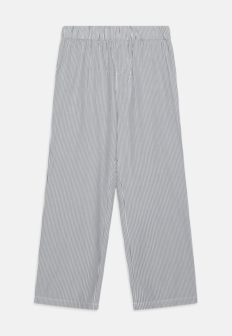 Pantalon large à rayures verticales noires et blanches avec une ceinture élastique, étalé à plat sur un fond blanc.
