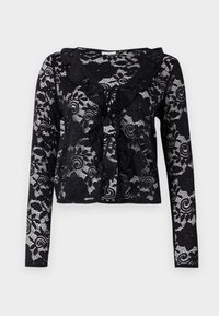 Cardigan lungo con maniche in pizzo nero, adornato da motivi floreali e vorticosi, con colletto arricciato e chiusura con fiocco. Leggero e con una trama trasparente.