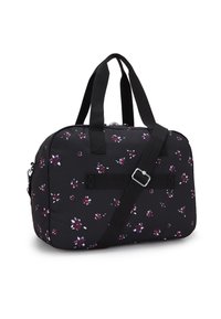 Svart tygväska med ett blommigt mönster i lila och vitt, med dubbla handtag på toppen och en justerbar axelrem.