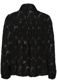Blusa nera trasparente con motivi floreali testurizzati, colletto, maniche lunghe e polsini abbottonati. Tessuto leggero con bordi sfrangiati.