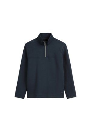 Tumesine pullover, mille krae, veerandi lukuga esiosas, pika varrukaga, valmistatud siledast kudumist, millel on diskreetne logo detail allääres.