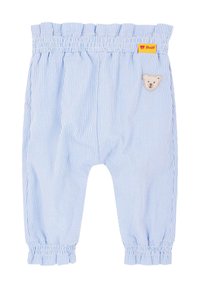 Pantalons rayés bleu et blanc avec une taille élastique et un haut à volants. Présente un patch de ours en peluche à l'avant et des poignets élastiques.