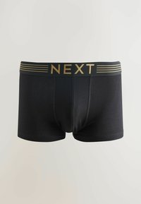 Boxers noirs ajustés avec une coupe près du corps, dotés d'une large ceinture élastique embossée avec "NEXT" en doré et de lignes horizontales subtiles.