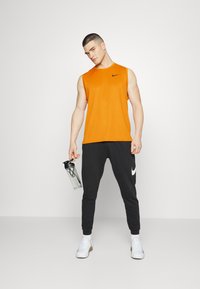 Nike Performance DRY TANK - Top - mantra orange/kumquat/heather/black