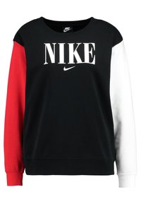 Black sweatshirt with red and white sleeves. Features bold white "NIKE" logo in front and a small Swoosh logo. Soft cotton material.