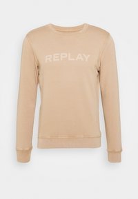 Felpa beige con colletto girocollo caratterizzata dalla scritta "REPLAY" stampata in un beige leggermente più scuro. Tessuto liscio, maniche lunghe e polsini e orlo a coste.