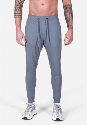 MOROTAI NKMR  - Tracksuit bottoms - light grey