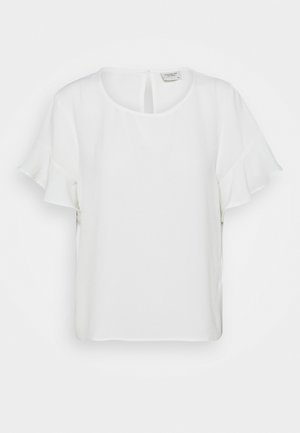 Blouse blanche à manches courtes avec manches volantées et encolure ronde, présentée sur un fond blanc uni.