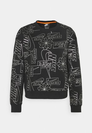 Black sweatshirt with white Nike branding and logos. Features round neckline, long sleeves, and ribbed cuffs and hem. Made of soft fabric.