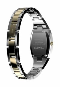 Montre en acier inoxydable avec des tons argent et or, dotée d'un bracelet à maillons, présentant un boîtier rectangulaire et une couronne surélevée. Détails de la marque gravés au dos.